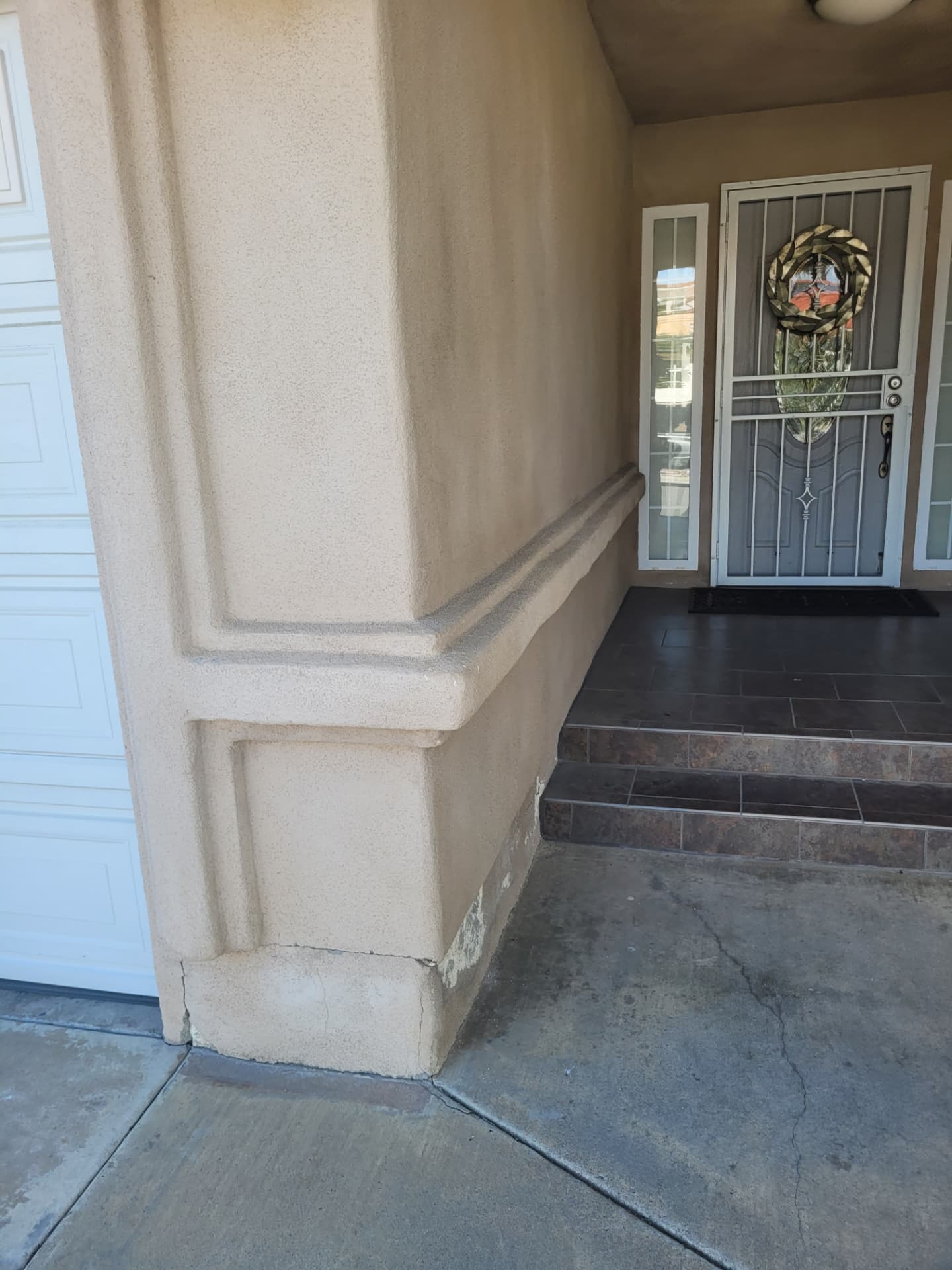 Porch after — clean stucco